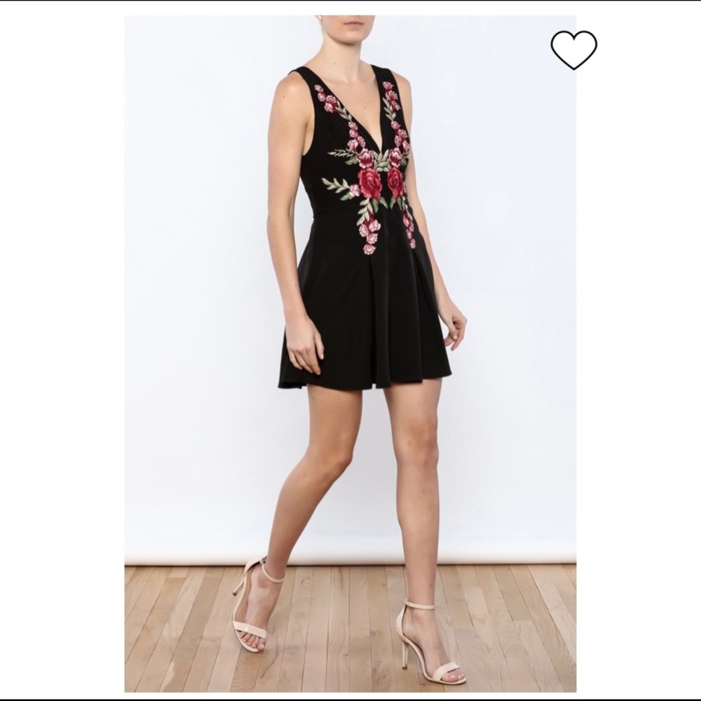 Black cocktail dress with floral embroidery